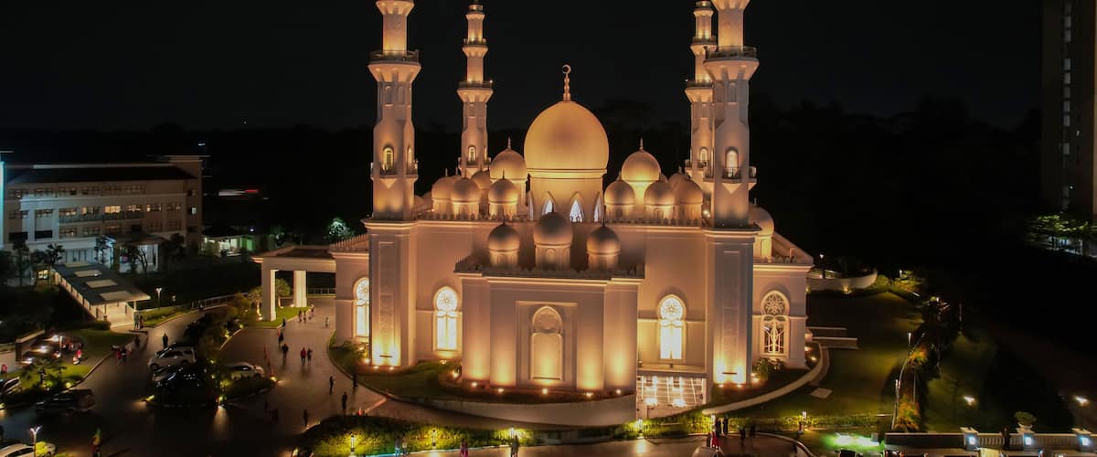 Aerial view of At-Thohir Mosque panorama at nihgt view Largest Mosque in Depok Place to visit in Indonesia. Depok, Indonesia, April 21, 2022