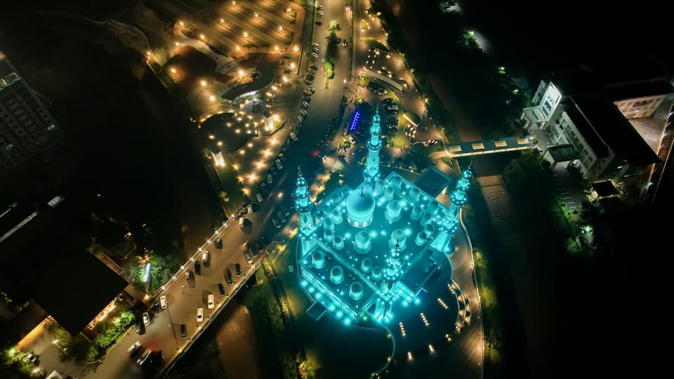 Aerial view of At-Thohir Mosque panorama at nihgt view Largest Mosque in Depok Place to visit in Indonesia. Depok, Indonesia, April 21, 2022