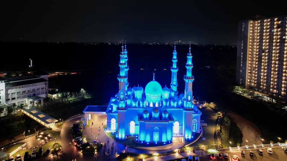 Aerial view of At-Thohir Mosque panorama at nihgt view Largest Mosque in Depok Place to visit in Indonesia. Depok, Indonesia, April 21, 2022