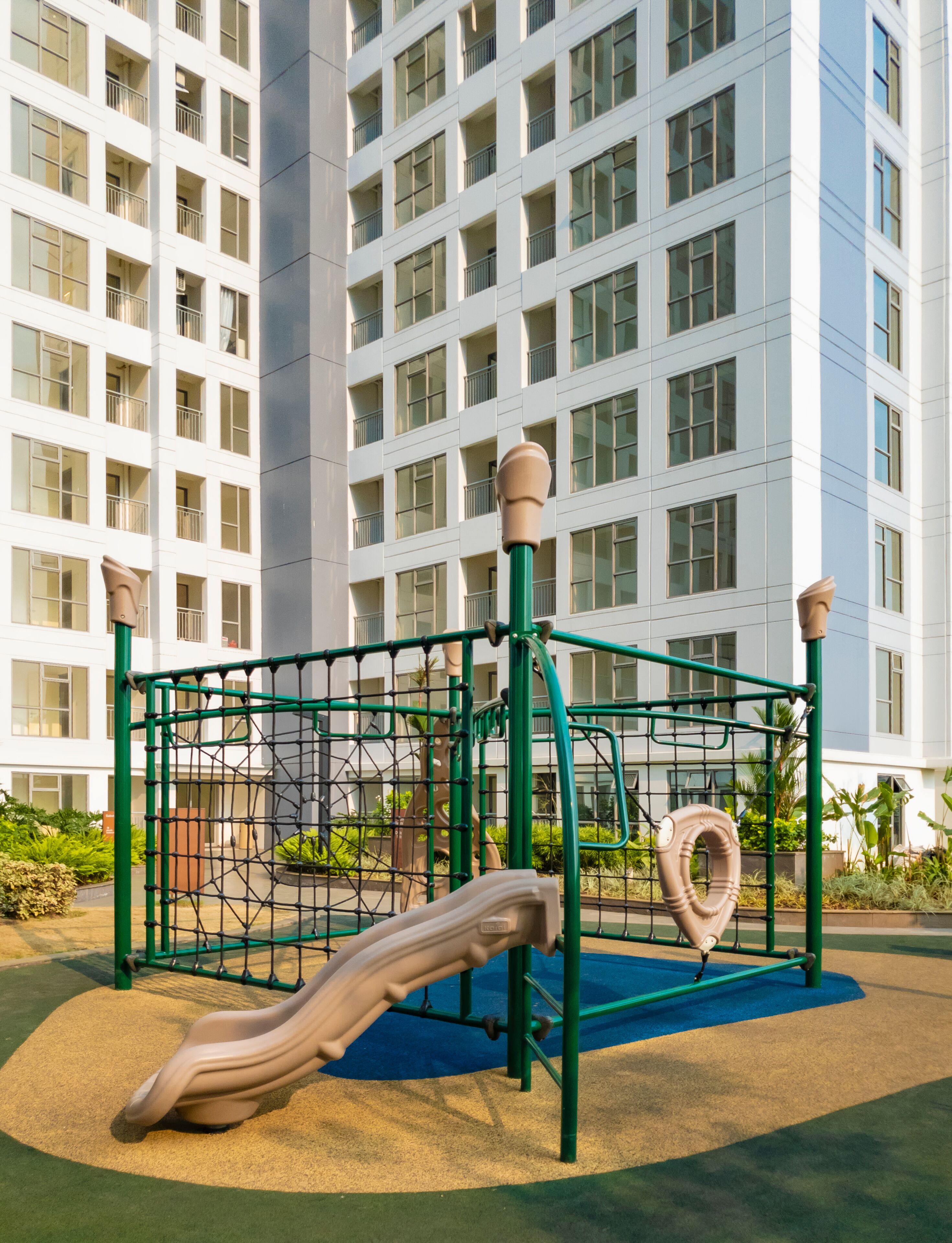 Tangerang, Indonesia - 6th Sep 2019: Playground with slide in M-Town Residences apartment buildings in Summarecon Serpong, Tangerang, Indonesia.