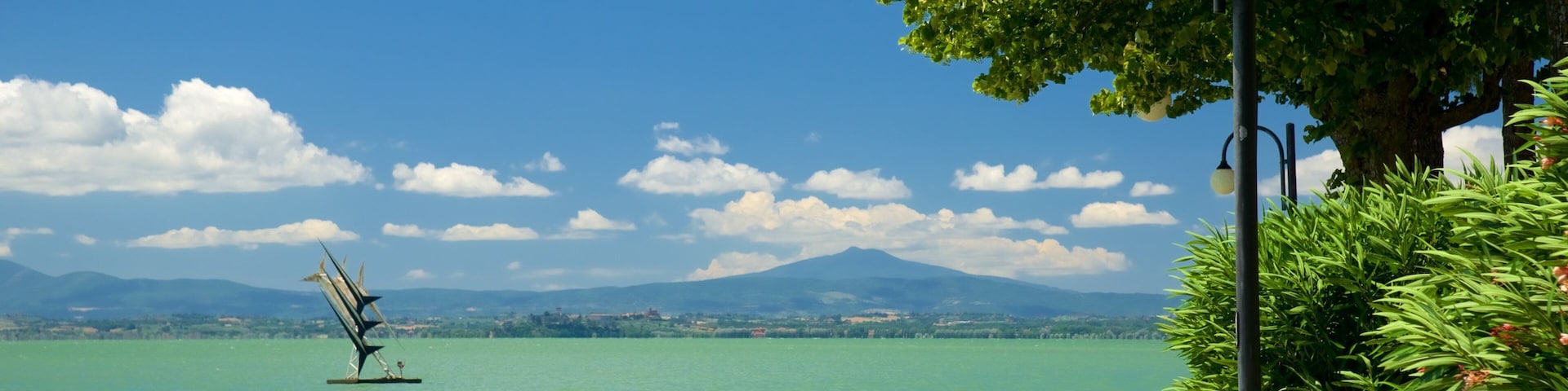 Passignano sul Trasimeno showing outdoor art and a river or creek