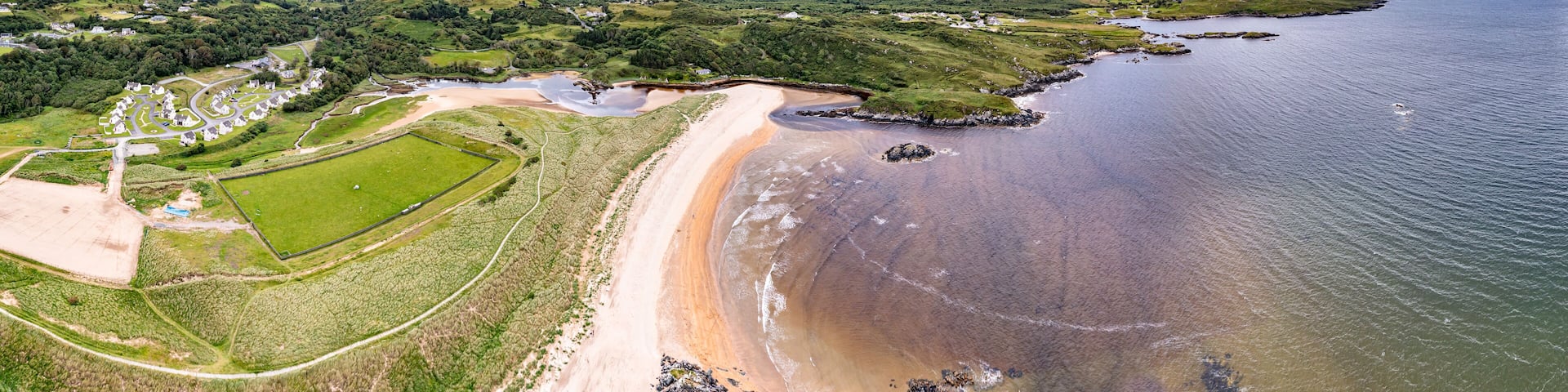 Aerial of the mouth of the Fintragh river at Fintra beach by Killybegs, County Donegal, Ireland