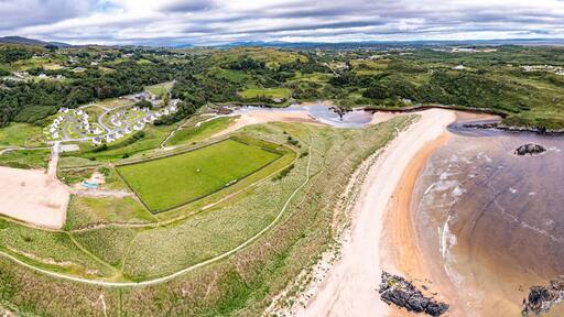 Aerial of the mouth of the Fintragh river at Fintra beach by Killybegs, County Donegal, Ireland