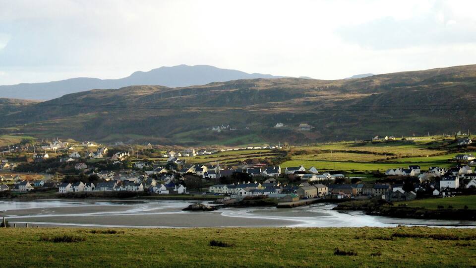A coastal town with houses and a river.