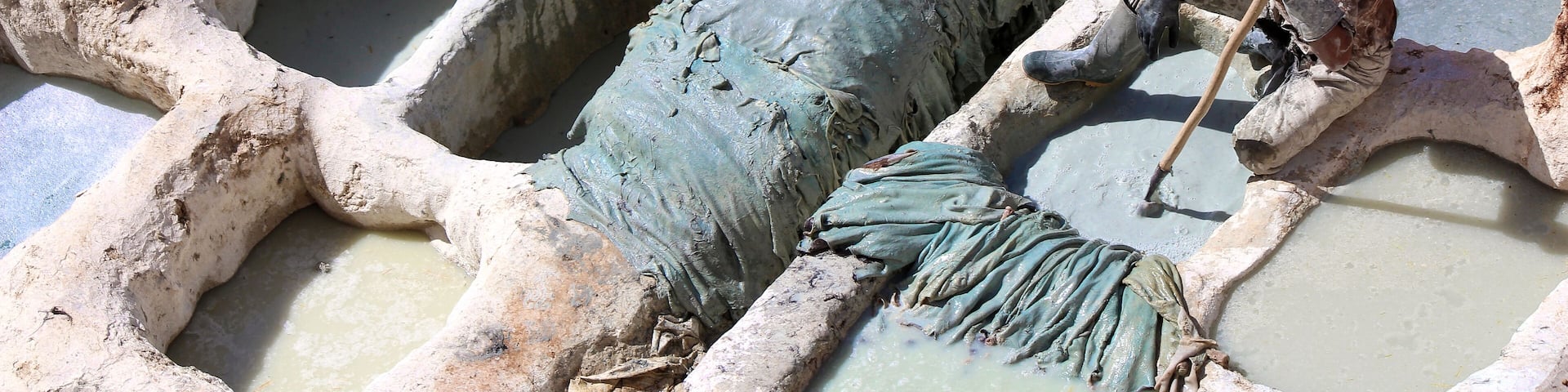 The Chouara Tannery of Fez, Morocco dates back to the 11th century, it operates much the same way it has since its inception.
In this photo a young man dyes the hides of cows, sheep, goats, and camels inside of stone vessels. The solution that they use to clean and soften the skins is a mixtures of cow urine, pigeon feces, quicklime, salt, and water. #history