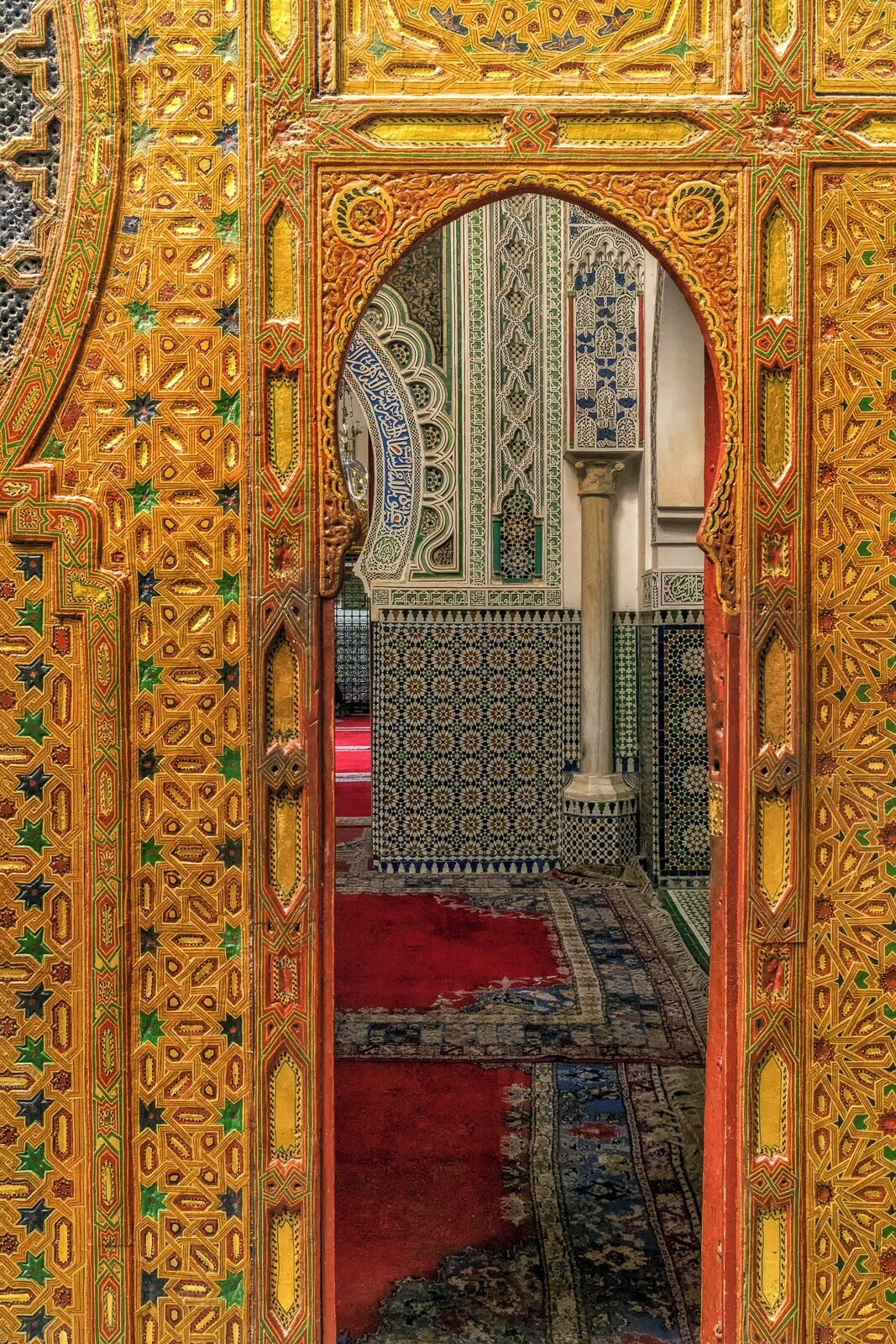 Kairaouine Mosque, Fez, Morocco. One of the largest in Africa, and among the oldest universities in the world, the mosque dates to the year 859. It's an incredible, ornate jewel of a complex located in the center of the dark, dirty, chaotic old media of Fez. They open the doors to allow tourists a peak inside. Also, great opportunities for pick pockets to make some cash! My iPhone was stolen from my shoulder bag while taking this picture. I was too distracted by the amazing decor!