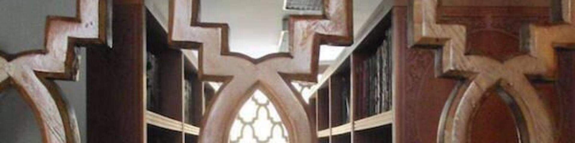 A wooden lattice structure with a window in the center.