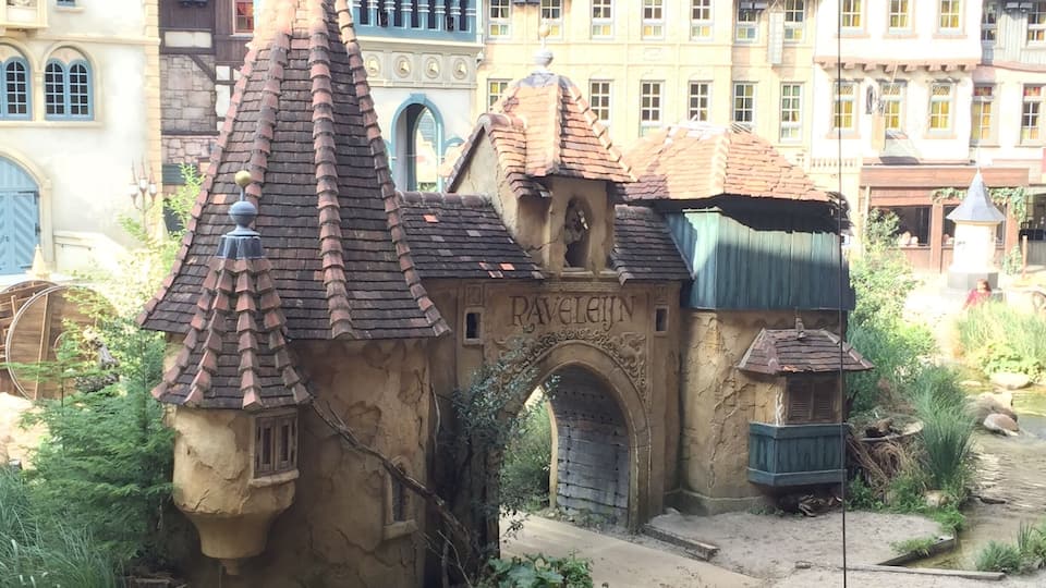 A small, rustic building with a pointed roof and a sign that reads "Pavlova".