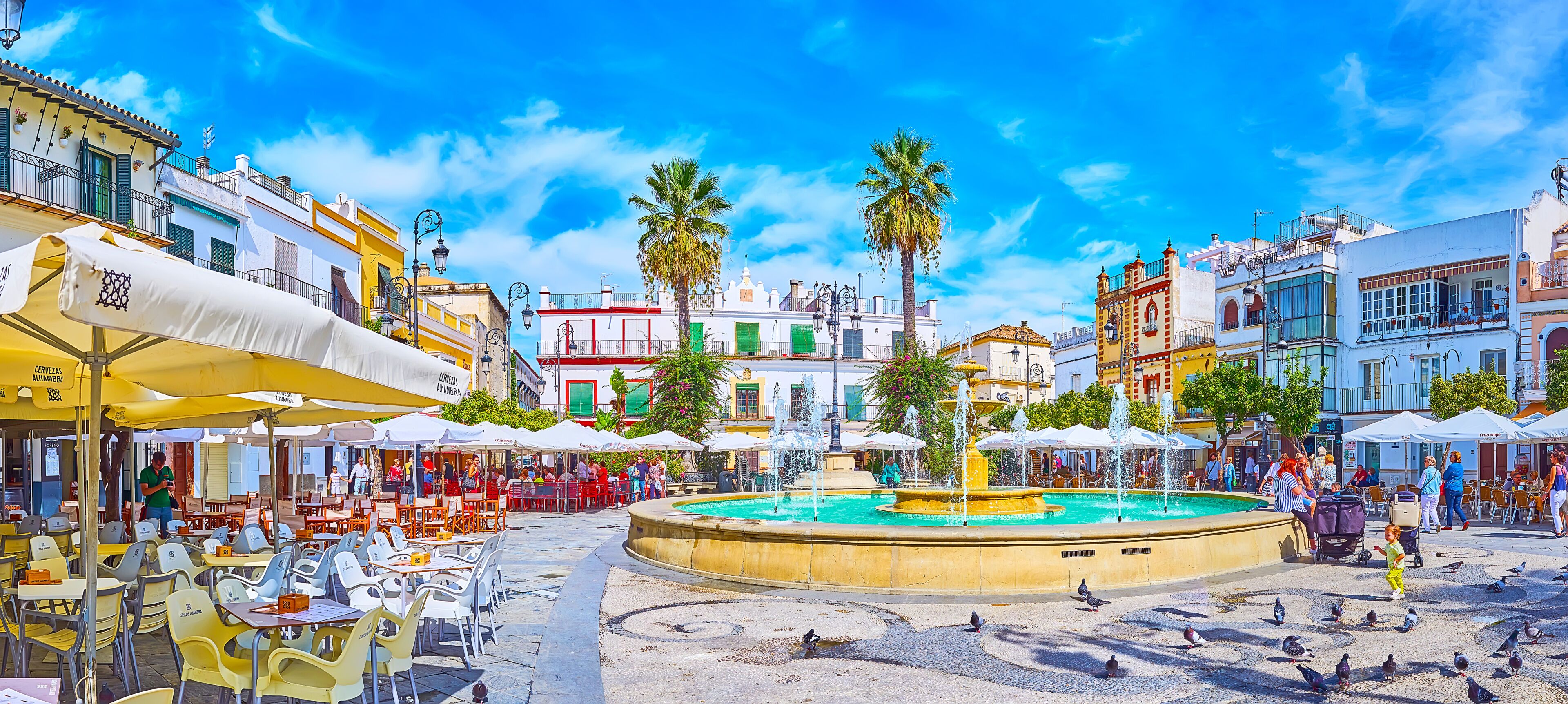 Panorama of Plaza del Cabildo square with fountains and restaurants, Sanlucar, Spain