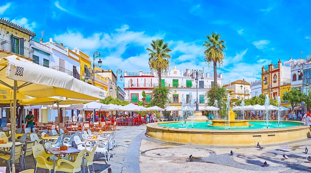 Panorama of Plaza del Cabildo square with fountains and restaurants, Sanlucar, Spain