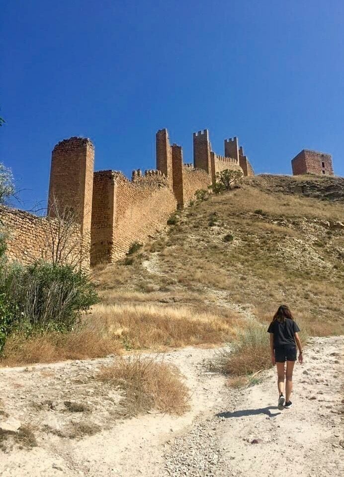 Hike to the top of the castle ruins along the ancient wall to get the best views of the town ...