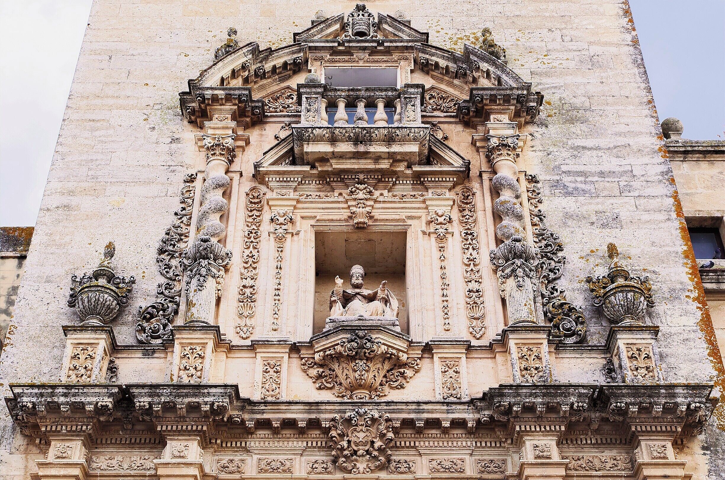 Saint Peter watching over his flock.  The 18th-century facade is a Baroque design plastered onto a 14th-century church, that itself was built atop the remains of an Arab fortress.