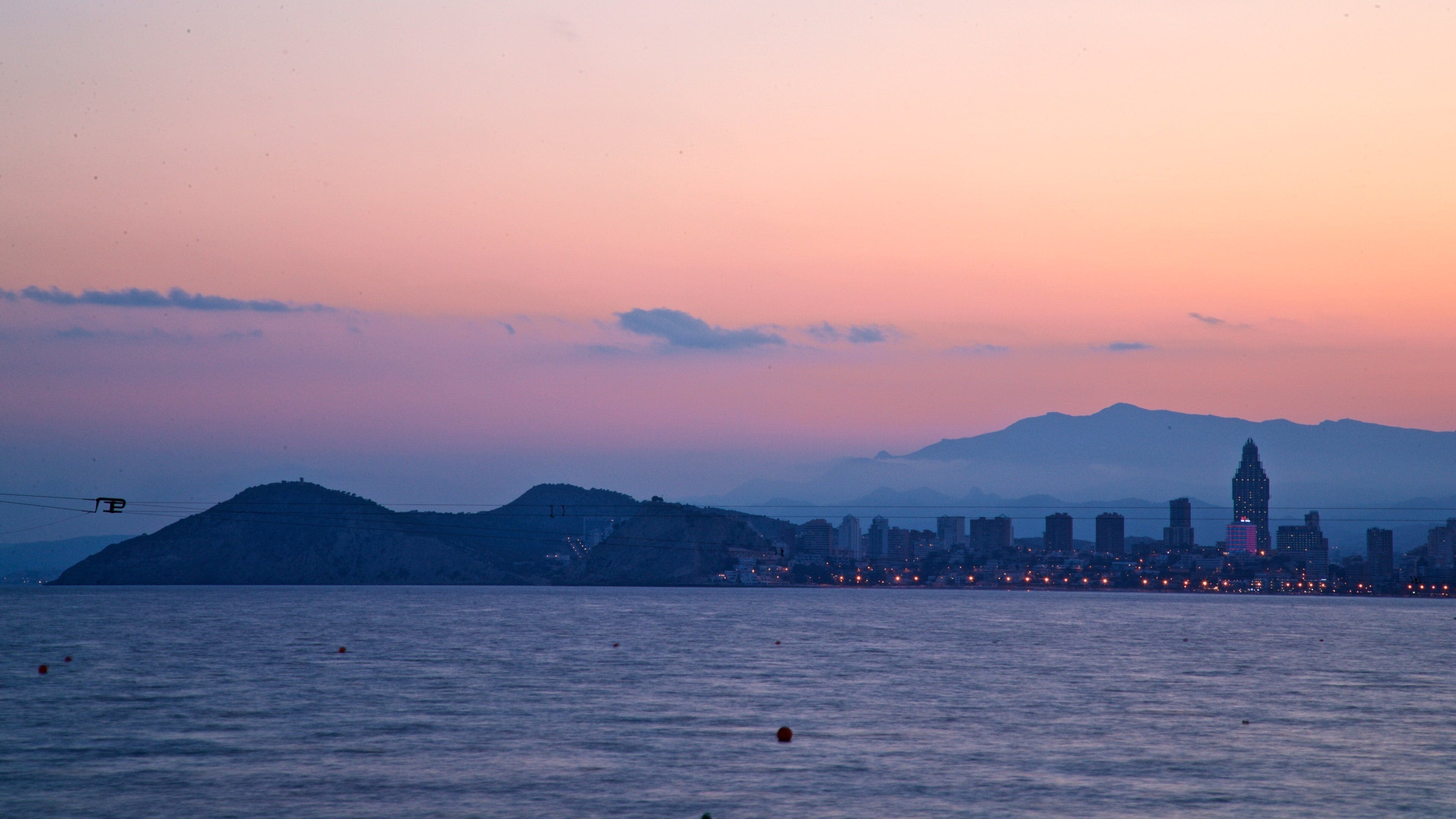 Benidorm showing a sunset and general coastal views