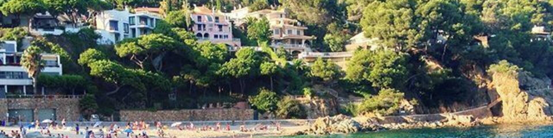 If you're in Catalonia in the summer, a trip to the Costa Brava's beautiful coastline. This little cove is the Cala de San Francisco in Blanes, and a completely magical place to spend a day.
Just out of sight in this picture is a restaurant that serves up traditional local food, particularly seafood. Try the rice dishes - the arroz negre is especially delicious!