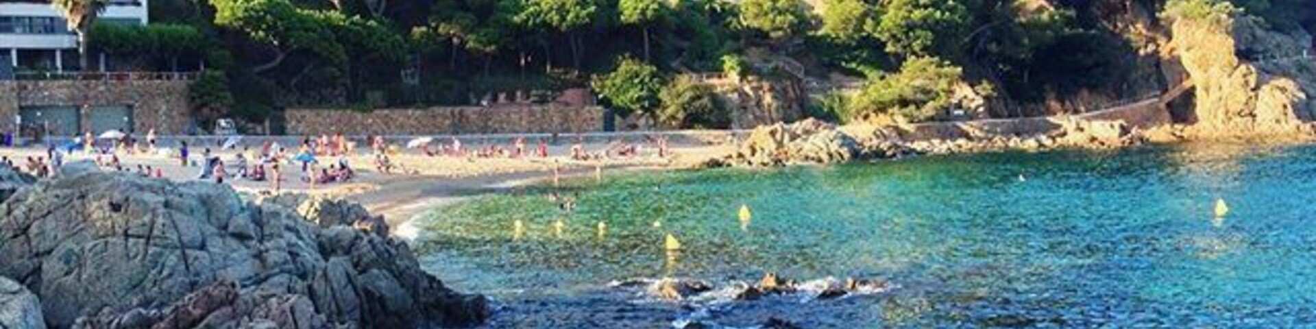 If you're in Catalonia in the summer, a trip to the Costa Brava's beautiful coastline. This little cove is the Cala de San Francisco in Blanes, and a completely magical place to spend a day.
Just out of sight in this picture is a restaurant that serves up traditional local food, particularly seafood. Try the rice dishes - the arroz negre is especially delicious!