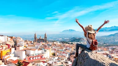 Woman tourist at Jaen, looking at panoramic view of the cathedral- Spain