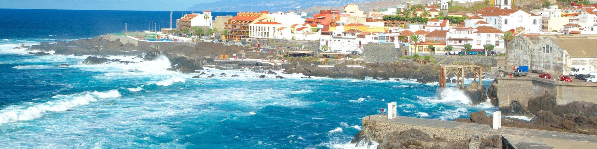 Garachico showing rugged coastline, surf and a coastal town