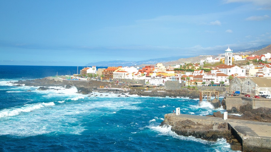 Garachico showing rugged coastline, surf and a coastal town