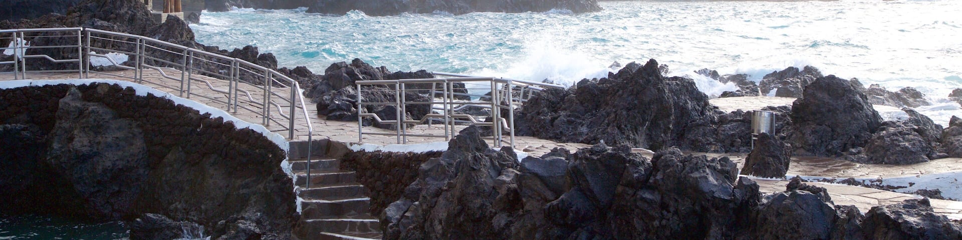 Garachico showing rugged coastline and a coastal town
