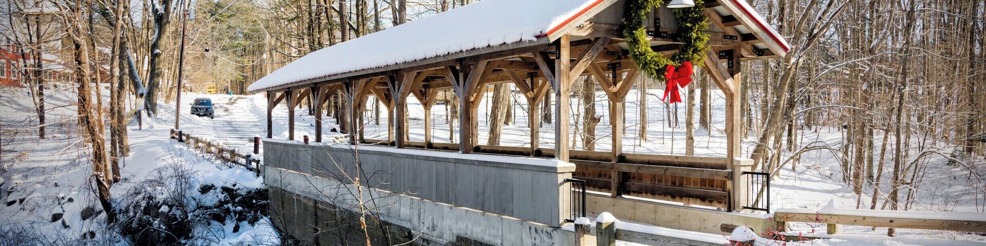 Old Stage Road Bridge straddles the Taylor River between Hampton Falls and Hampton, New Hampshire. Each town owns one half of the bridge, which connects two large conservation open spaces, Applecrest Orchards in Hampton Falls and the Hurd Dairy Farm in Hampton. A dam and waterfall grace the site.