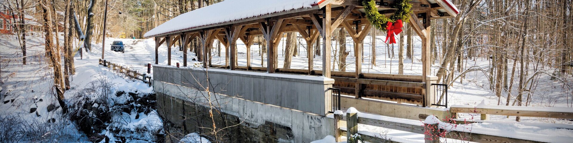 Old Stage Road Bridge straddles the Taylor River between Hampton Falls and Hampton, New Hampshire. Each town owns one half of the bridge, which connects two large conservation open spaces, Applecrest Orchards in Hampton Falls and the Hurd Dairy Farm in Hampton. A dam and waterfall grace the site.