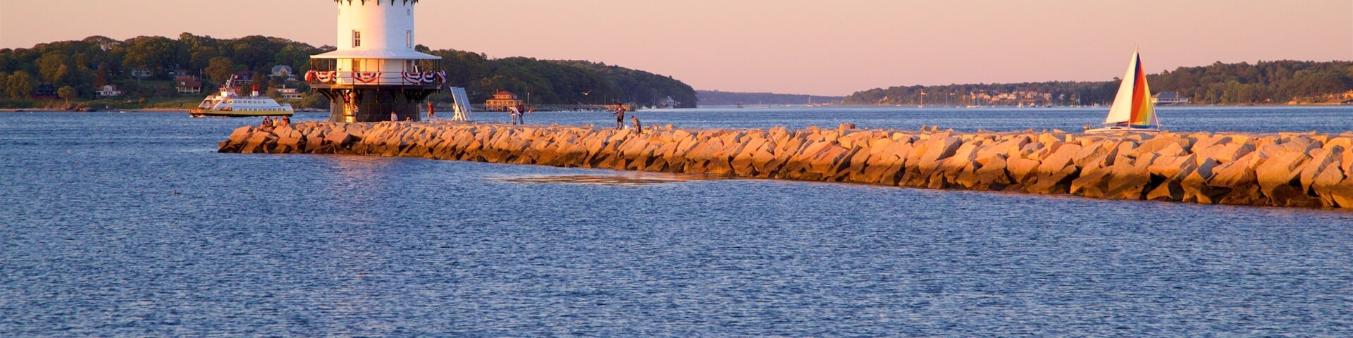 Spring Point Ledge Light que inclui um farol, um pôr do sol e paisagens litorâneas