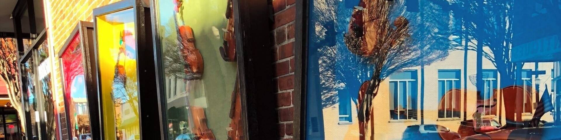 This picture was taken on Main Street in Galax, Va. These are fiddles that spell "Love" in four glass shadow boxes beside a music store called Barr's Fiddle Shop which has been in Galax for 40 years. Fiddles are one of the main instruments that mountain music is based on. When this music first started it was called hillbilly music which then later was called blue grass. When I saw this driving down Main Street, I knew that I wanted to take a picture of it because of the musical aspect and the history behind it. Because I have had a lot of experience of the Appalachian mountains, bluegrass is something that "characterizes a mountaineer", especially the older generation. This picture represents the love that mountain people have for this musical entertainment. This is shown through the annual Old Fiddlers Convention which occurs an entire week in August for the past 82 years. This event gathers thousands of people from all over the world who all share the love of Bluegrass. #appalachianechoes