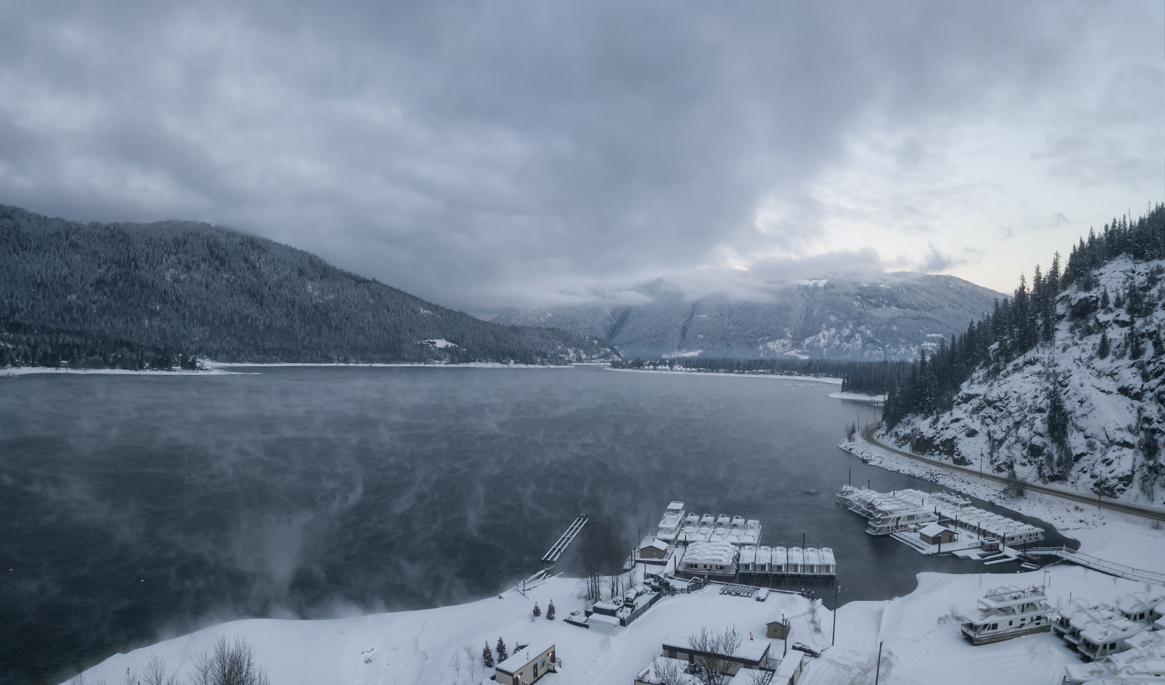 Striking aerial panoramic Canadian Mountain Landscape during a winter morning. Taken at Mara Lake near Sicamous, British Columbia, Canada.