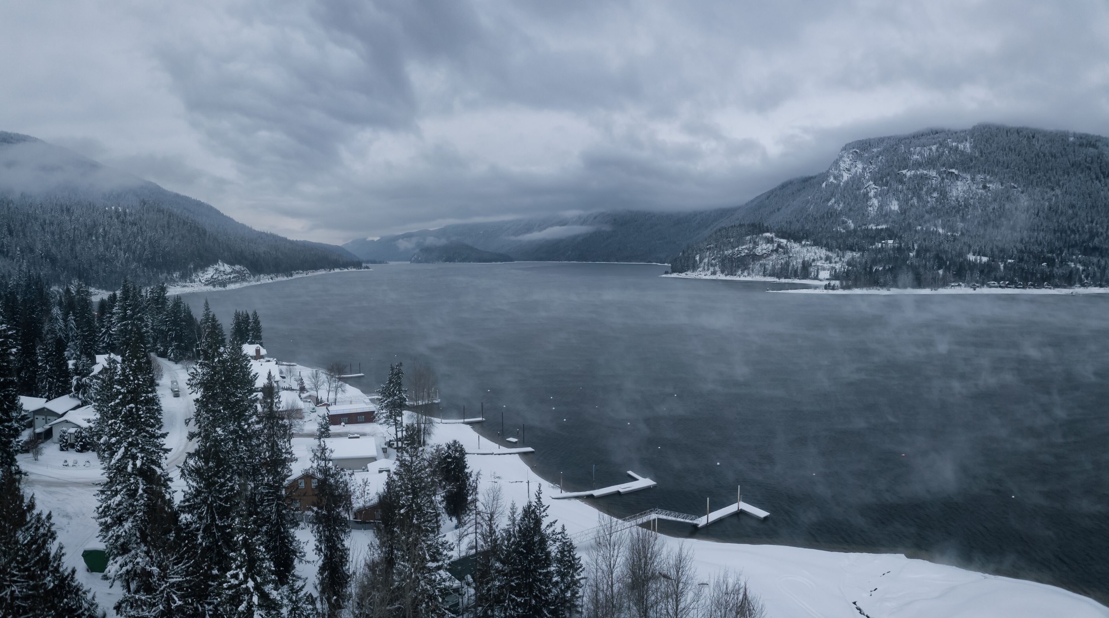 Striking aerial panoramic Canadian Mountain Landscape during a winter morning. Taken at Mara Lake near Sicamous, British Columbia, Canada.