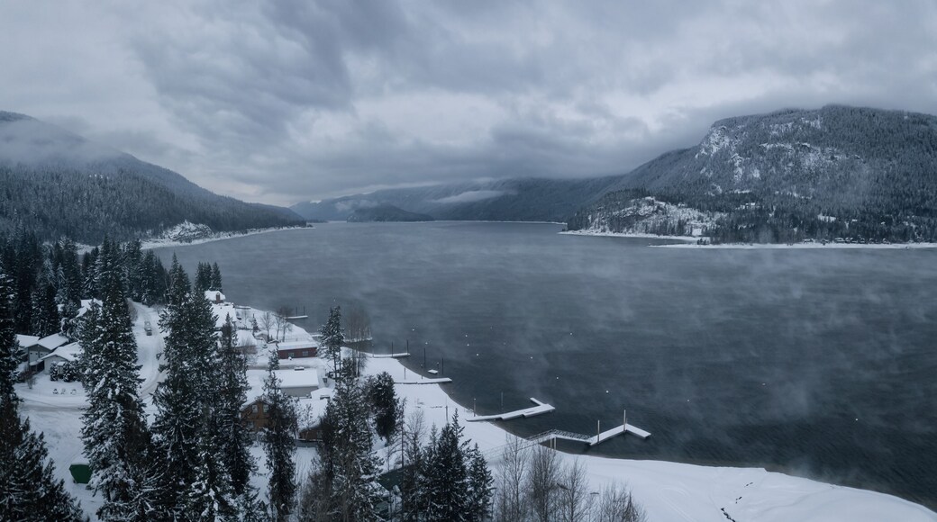 Striking aerial panoramic Canadian Mountain Landscape during a winter morning. Taken at Mara Lake near Sicamous, British Columbia, Canada.