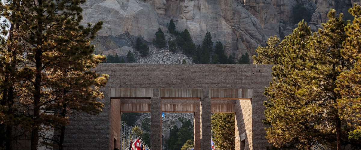 Mount Rushmore National Memorial with four presidential faces carved into the mountain.