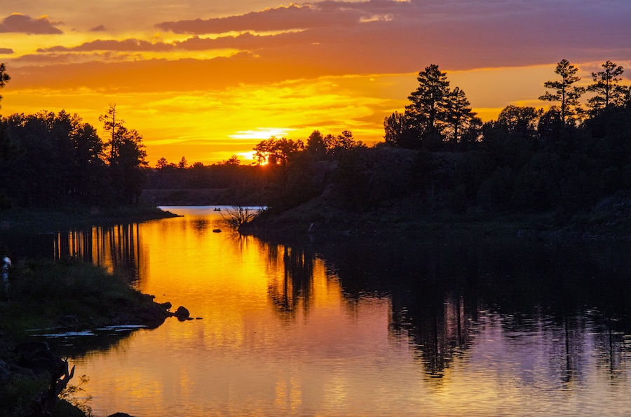 Sunset over a forest lake
