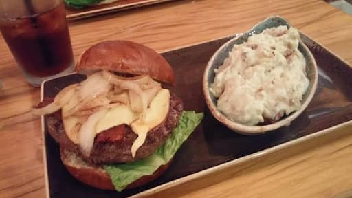 Wagyu beef, caramelized onions, bacon, smoked gouda and lime aioli on a pretzel roll.