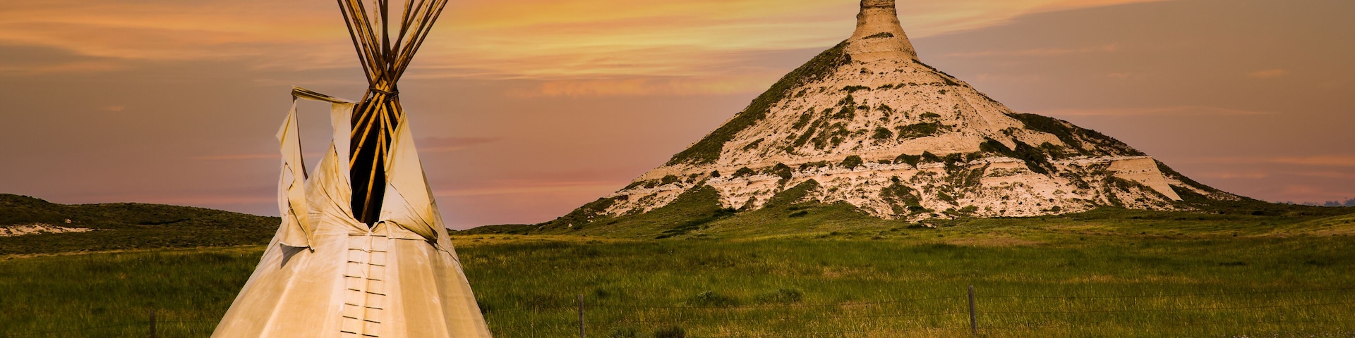 chimney rock national historic site. It is a prominent geological rock formation in western Nebraska, rising nearly 300 feet above the surrounding North Platte River valley