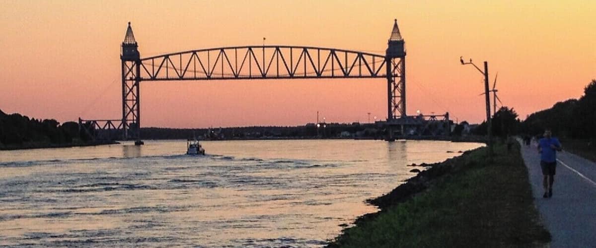 A bridge over a river at sunset.