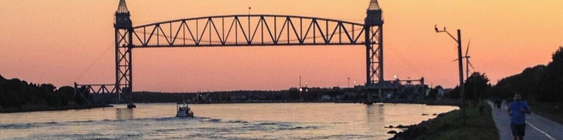 A bridge over a river at sunset.