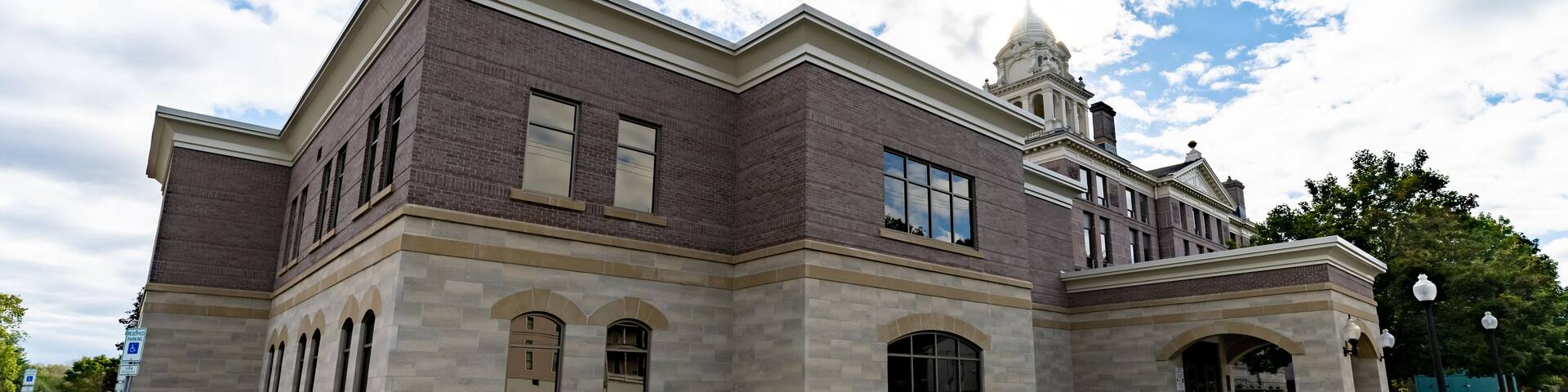 Wide Angle of Ionia County, MI Courthouse with Blue Sky and Green Grass