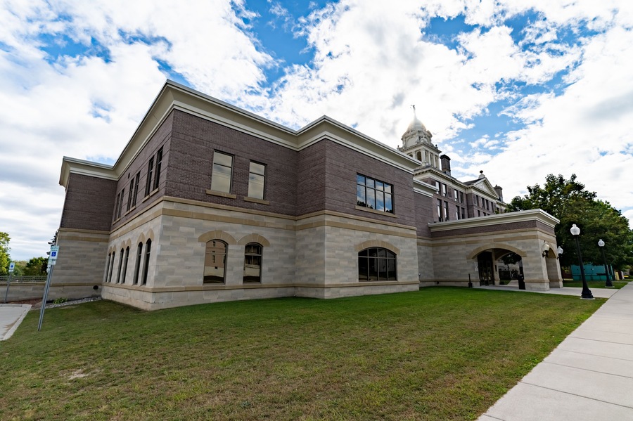 Wide Angle of Ionia County, MI Courthouse with Blue Sky and Green Grass