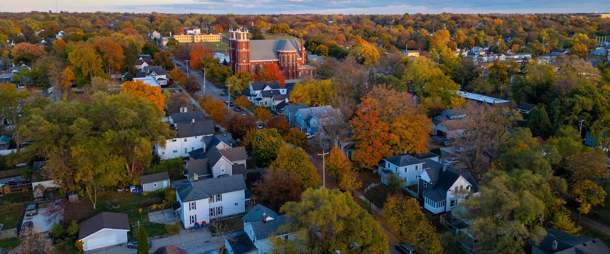 Aerial fall view of town and church in Grand Rapids Michigan