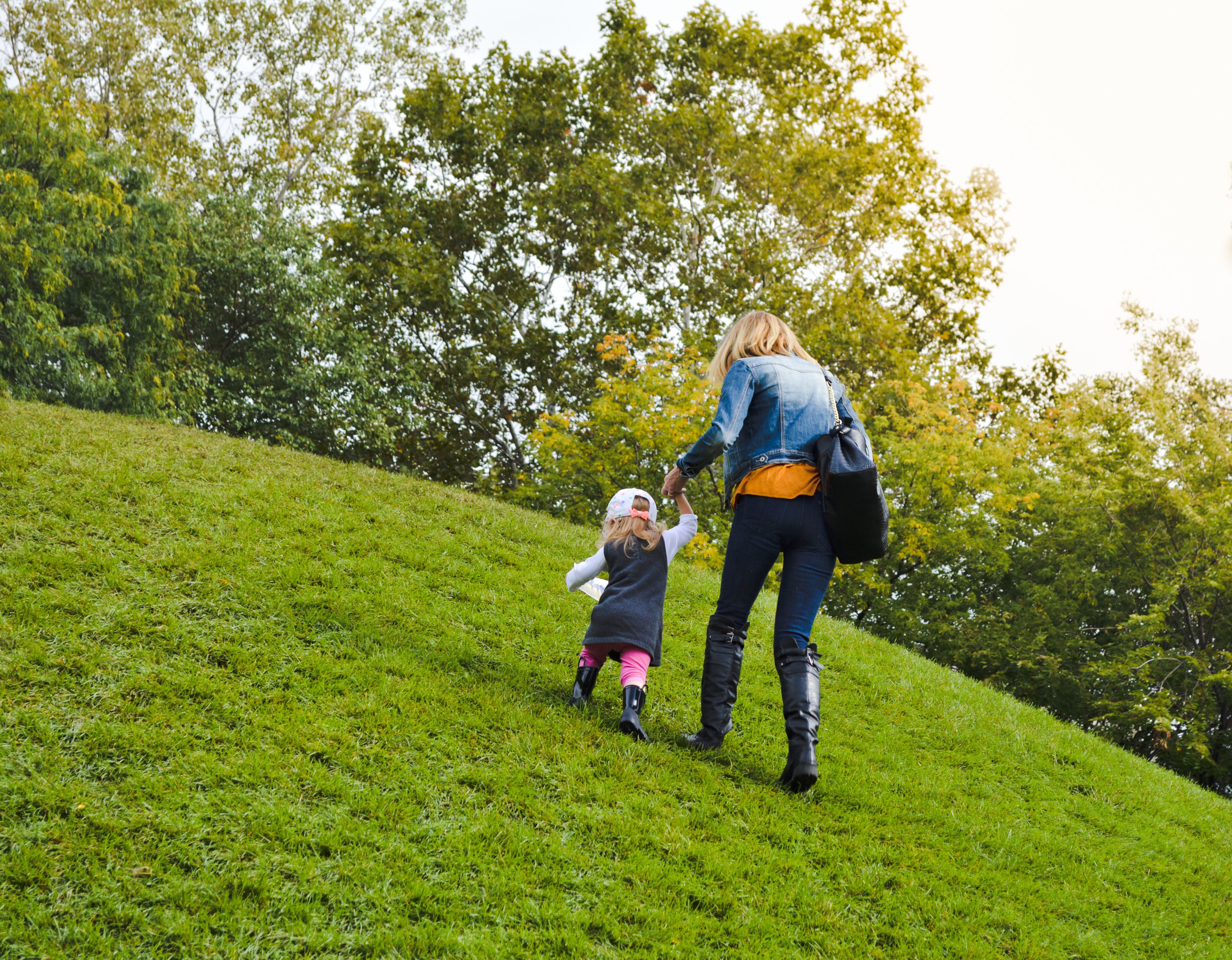 Mother and Daughter Climbing a hill at Ah-Nab-Awen Park, Grand Rapids, Michigan