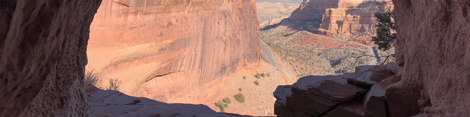 A canyon with a rock arch.