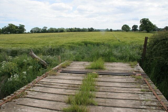 Bridge to Golden Grove This bridge leads to the public footpath across the field to the 13th Century Golden Grove pub which is to the far left of the picture.