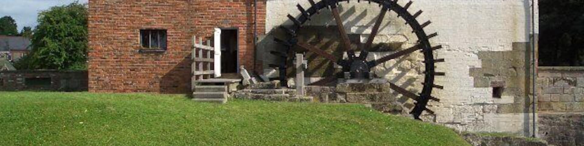 Waterwheel at Rossett Mill The large nineteenth century water wheel which powers the four pairs of millstones in Rossett Mill.