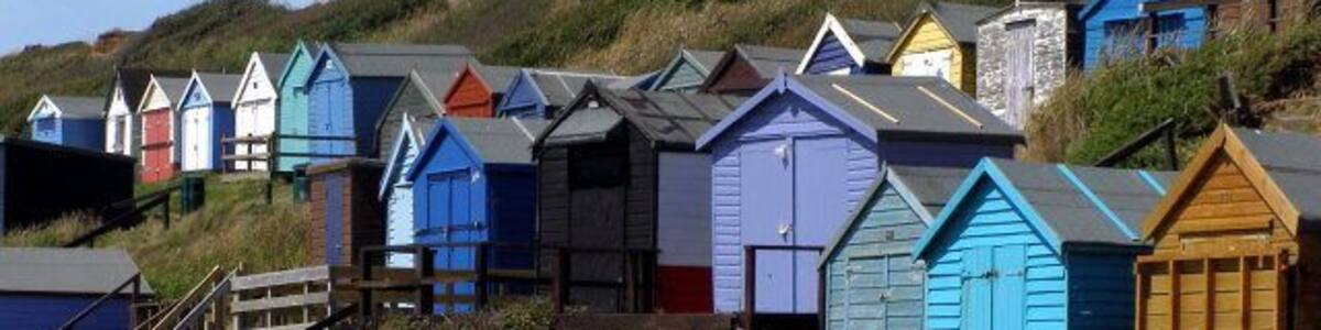 Beach huts, Milford on Sea Beach huts on the cliff at the western end of the beach at Milford on Sea. Wooden steps lead up to the path and car park at the cliff-top.