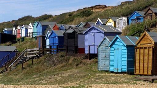 Beach huts, Milford on Sea Beach huts on the cliff at the western end of the beach at Milford on Sea. Wooden steps lead up to the path and car park at the cliff-top.