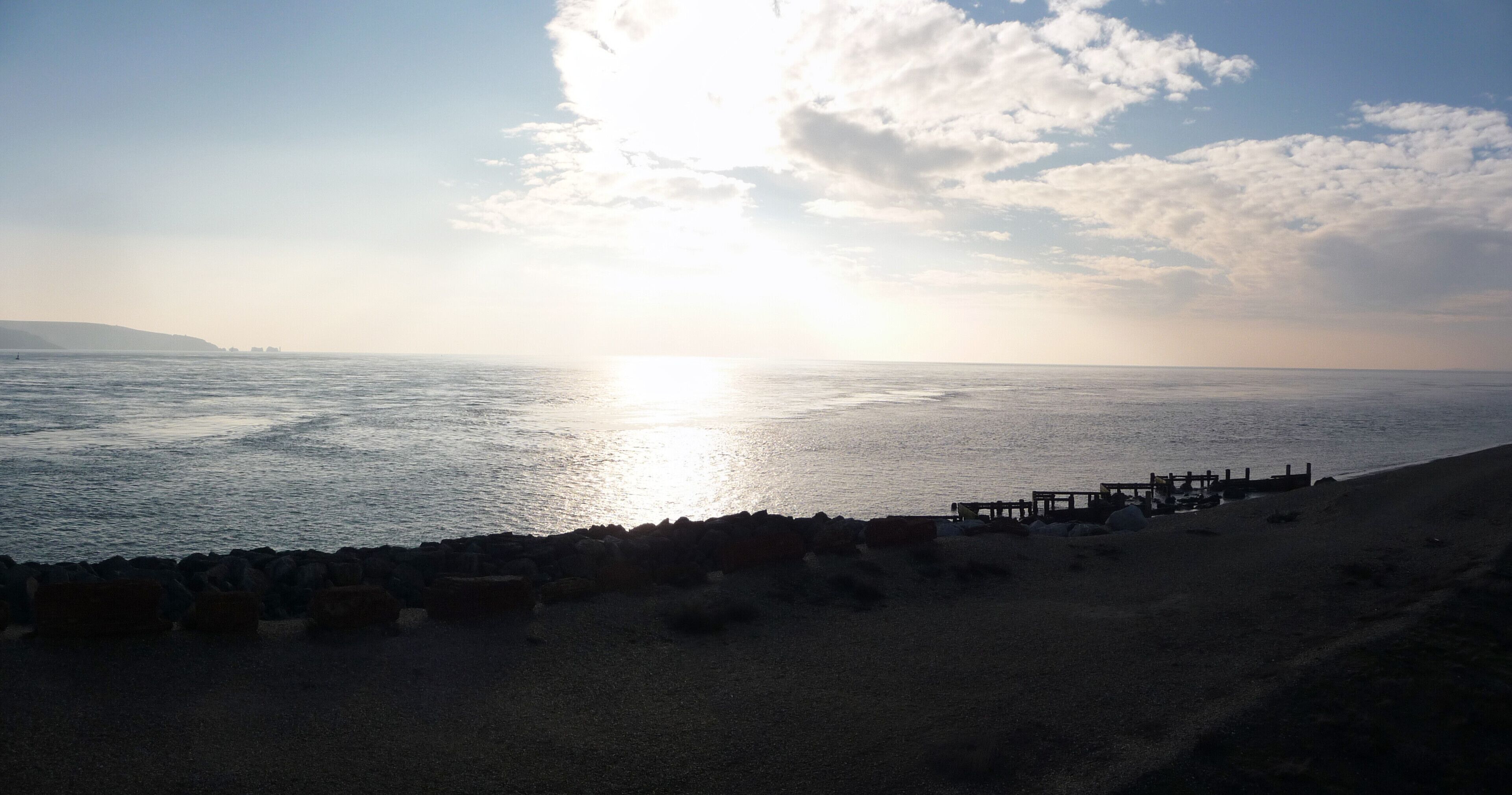 Hurst Spit : Setting Sun & The Solent From Hurst Castle looking across the spit, the sea and to part of the Isle of Wight where the Needles can be seen.