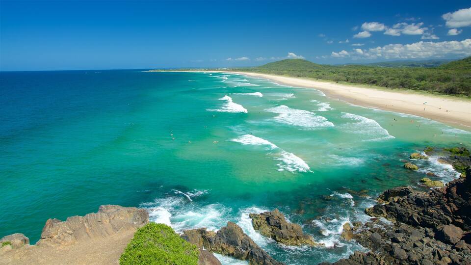 Cabarita Beach which includes a bay or harbour, waves and a sandy beach