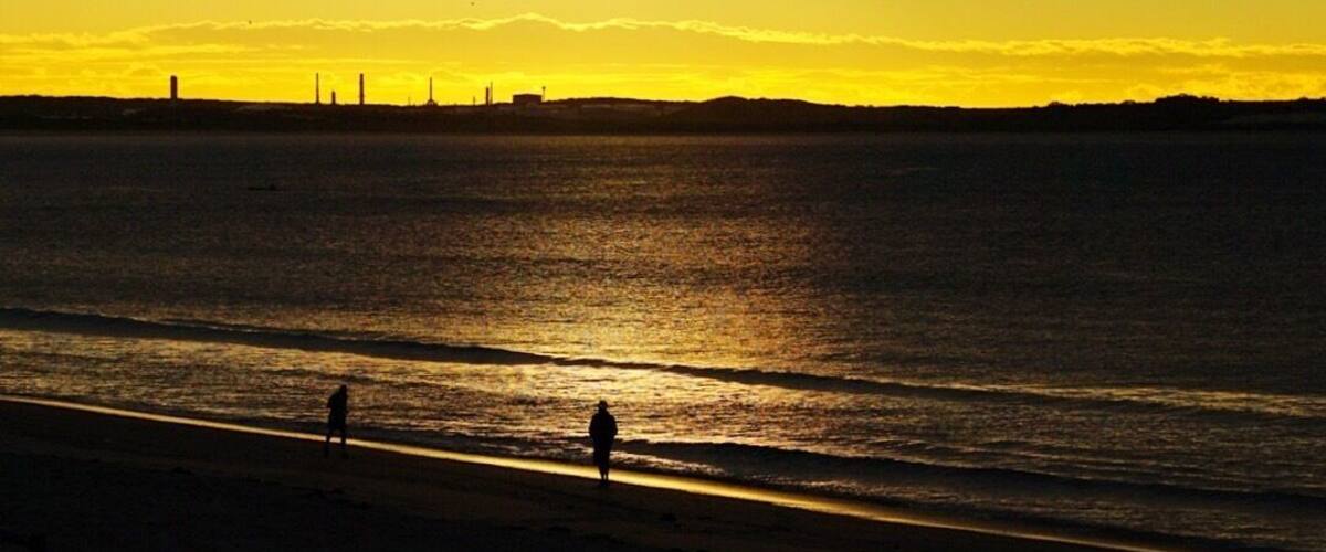 Shot at dawn of people taking their daily walk along the beach. In the distance is the now defunct petrochemical plant now in use a petrol storage facility.
This is a great part of the world worthy of inclusion in any Sydney itinerary.