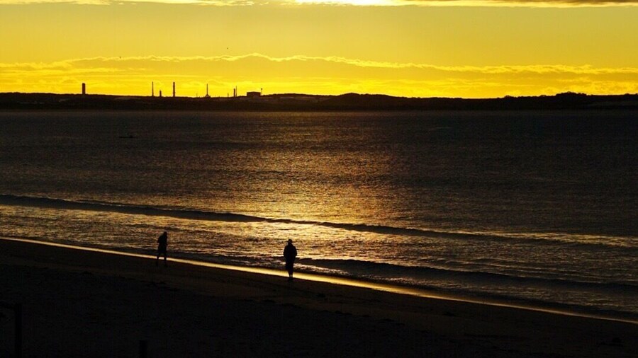 Shot at dawn of people taking their daily walk along the beach. In the distance is the now defunct petrochemical plant now in use a petrol storage facility.
This is a great part of the world worthy of inclusion in any Sydney itinerary.