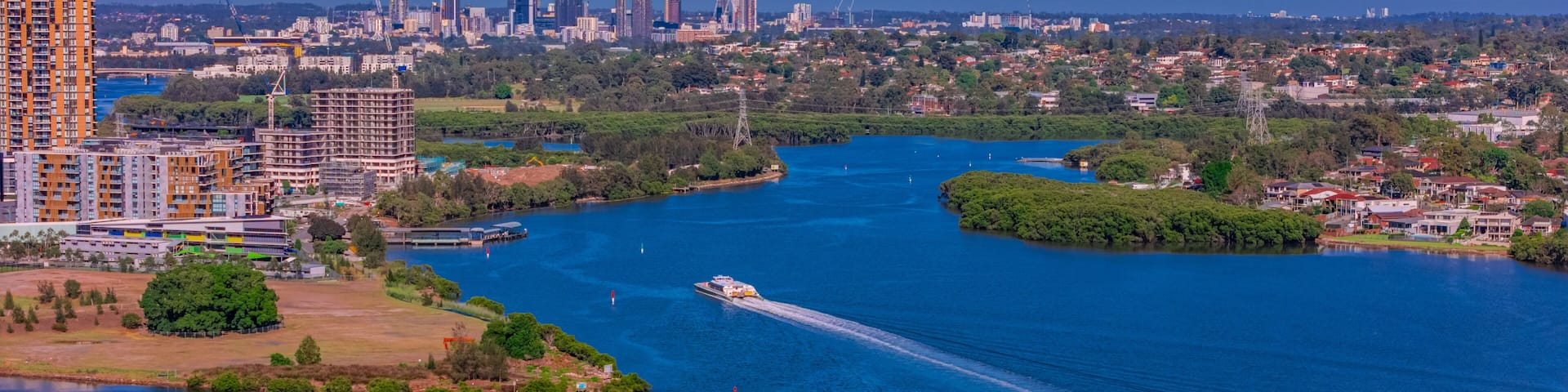 Panorama Aerial view above Rhodes with views to Meadowbank and Olympic park and Wentworth Point and Concord West with Parramatta River in Sydney NSW Australia